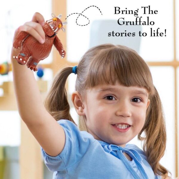 Girl playing with The Gruffalo and Mouse Girl playing with The Gruffalo and Mouse