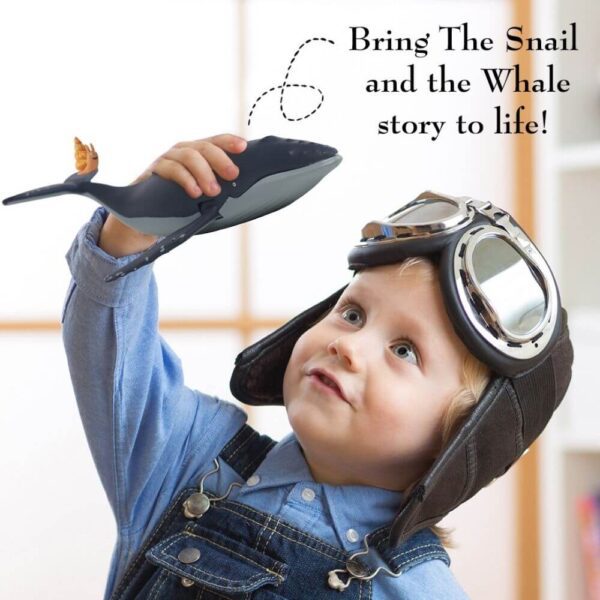 boy playing with The Snail & The Whale boy playing with The Snail & The Whale